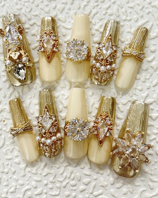 Luxury gold manicure, swirling Swarovski